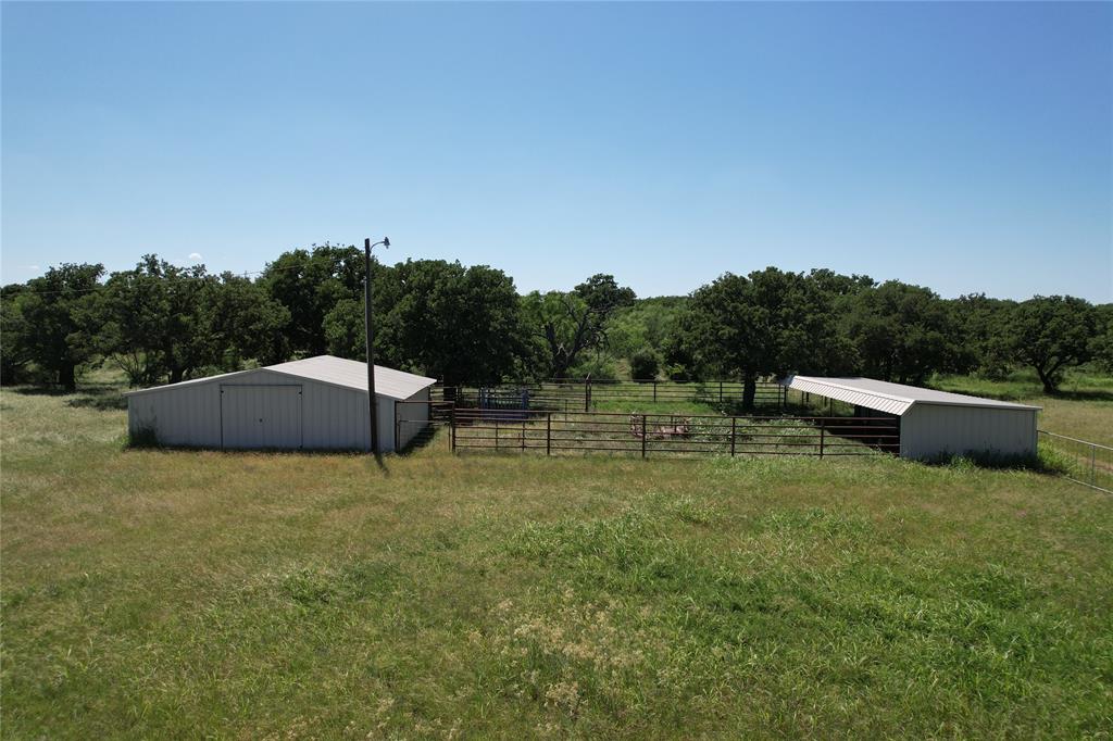628 Robinson Road Graham, TX 76450 - Photo 17 of 18 a backyard of a house with table and chairs