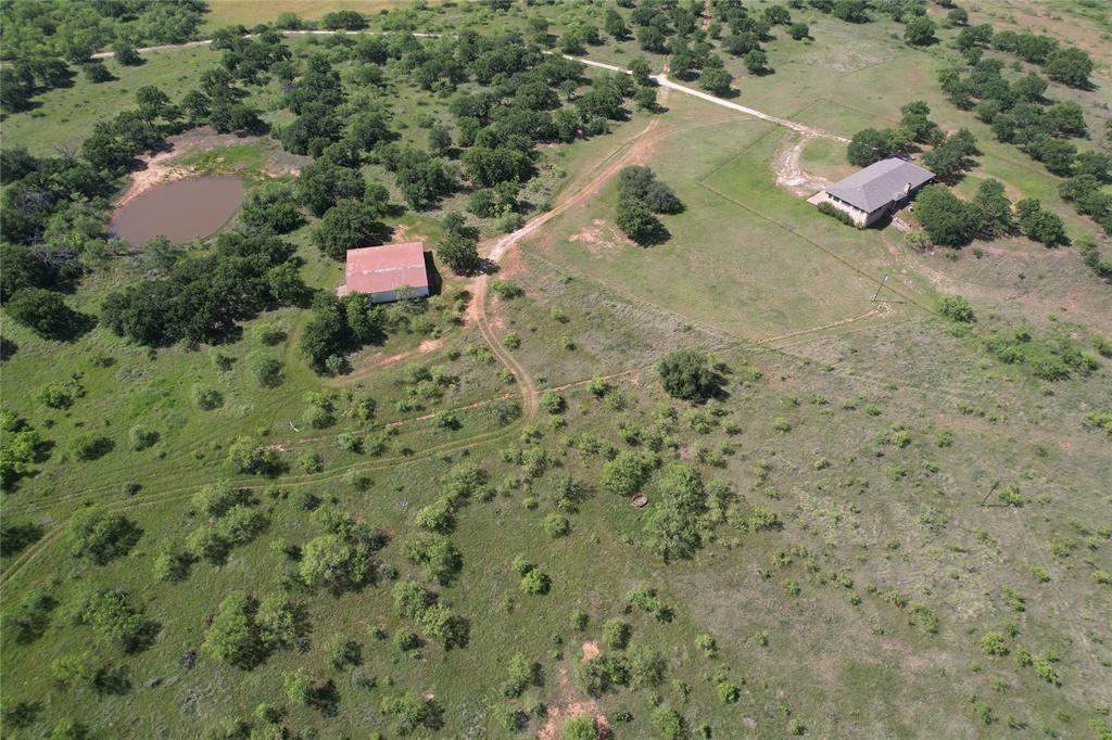 628 Robinson Road Graham, TX 76450 - Photo 5 of 18 a view of a dry yard with lots of trees