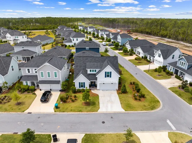 an aerial view of residential houses with outdoor space