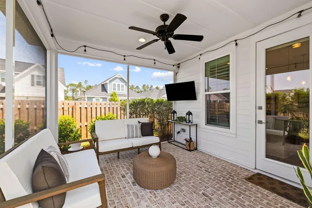 a view of a kitchen sink and microwave