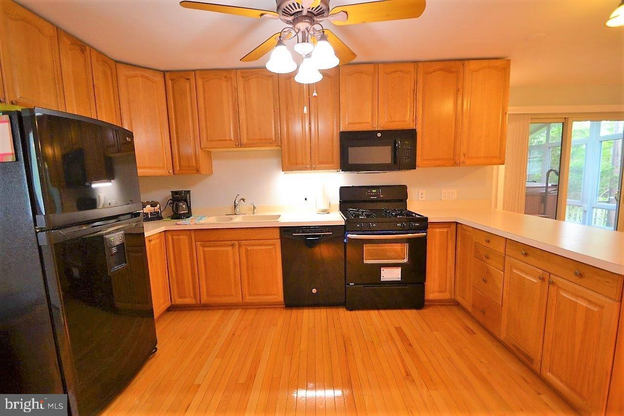 223 Candytuft Road Reisterstown, MD 21136 - Photo 8 of 30 Gleaming wood floors in kitchen