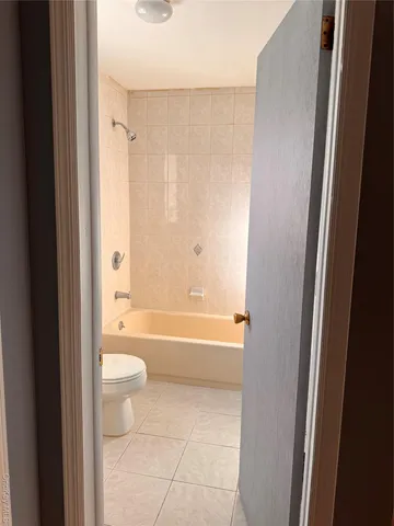 a view of front door with wooden floor