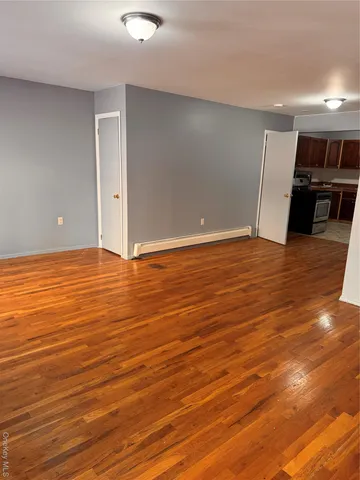 a view of a kitchen with wooden floor