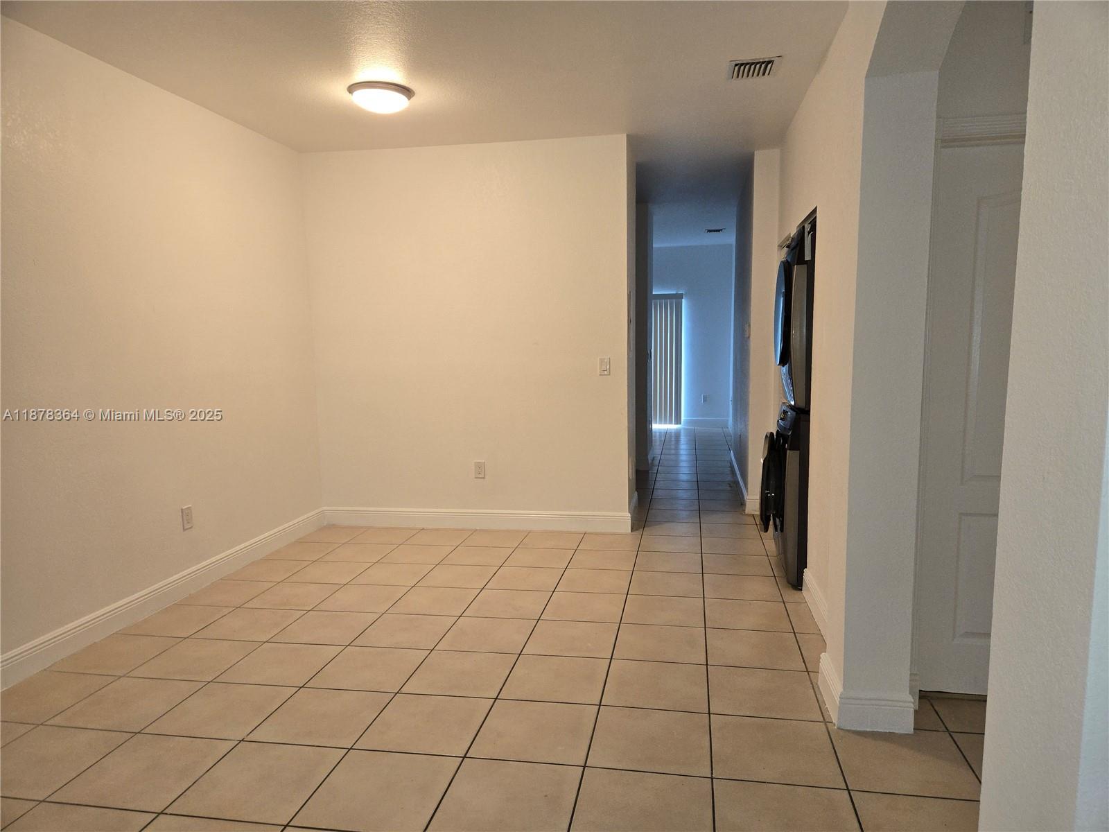 2903 Southeast 17th Avenue, Unit 111 Homestead, FL 33035 - Photo 3 of 15 a view of an empty room and window