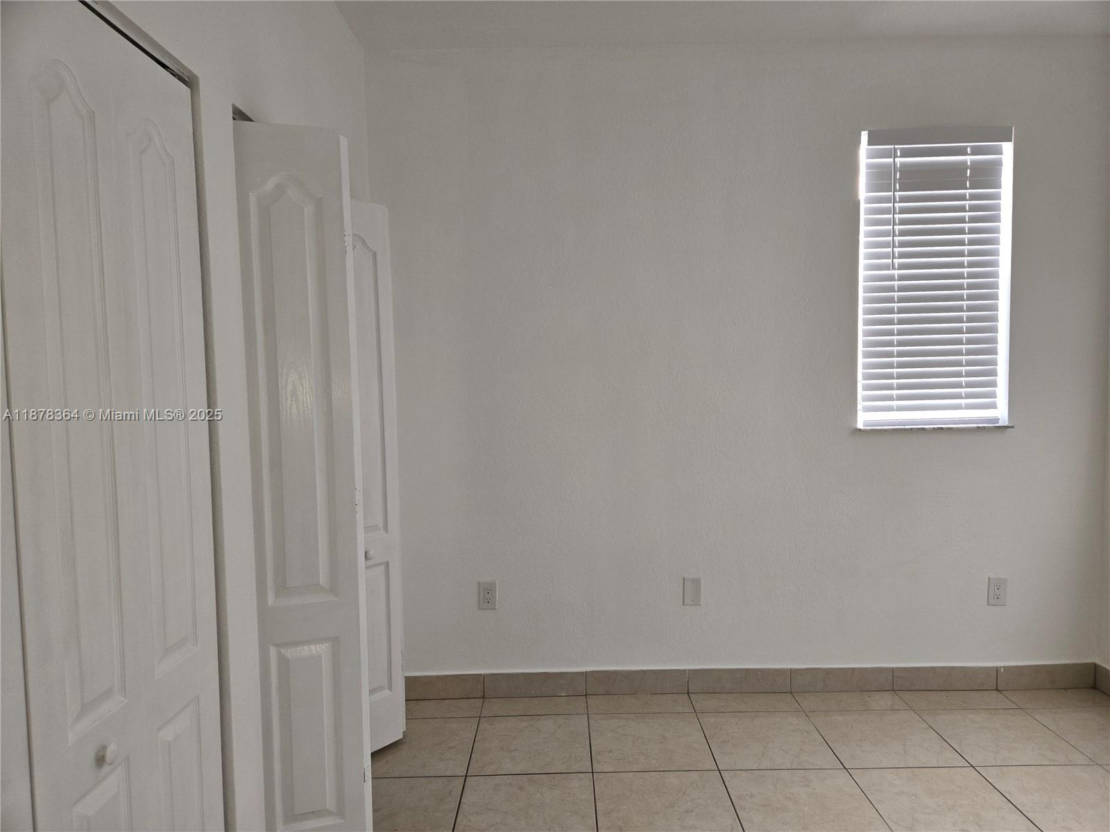 2903 Southeast 17th Avenue, Unit 111 Homestead, FL 33035 - Photo 5 of 15 a view of a room that has a window
