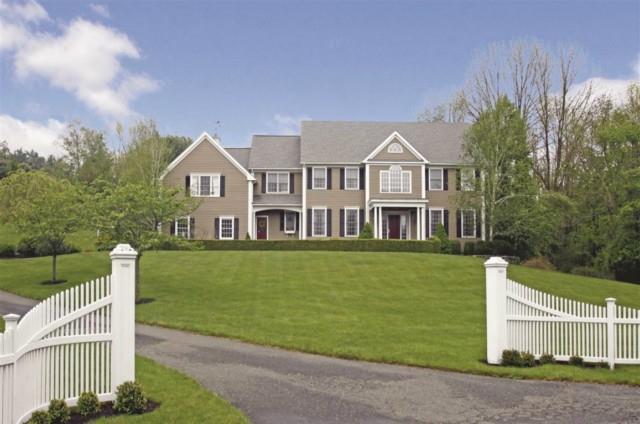 11 Powdermaker Drive Ridgefield, CT 06877 - Photo 1 of 1 a front view of a house with a garden