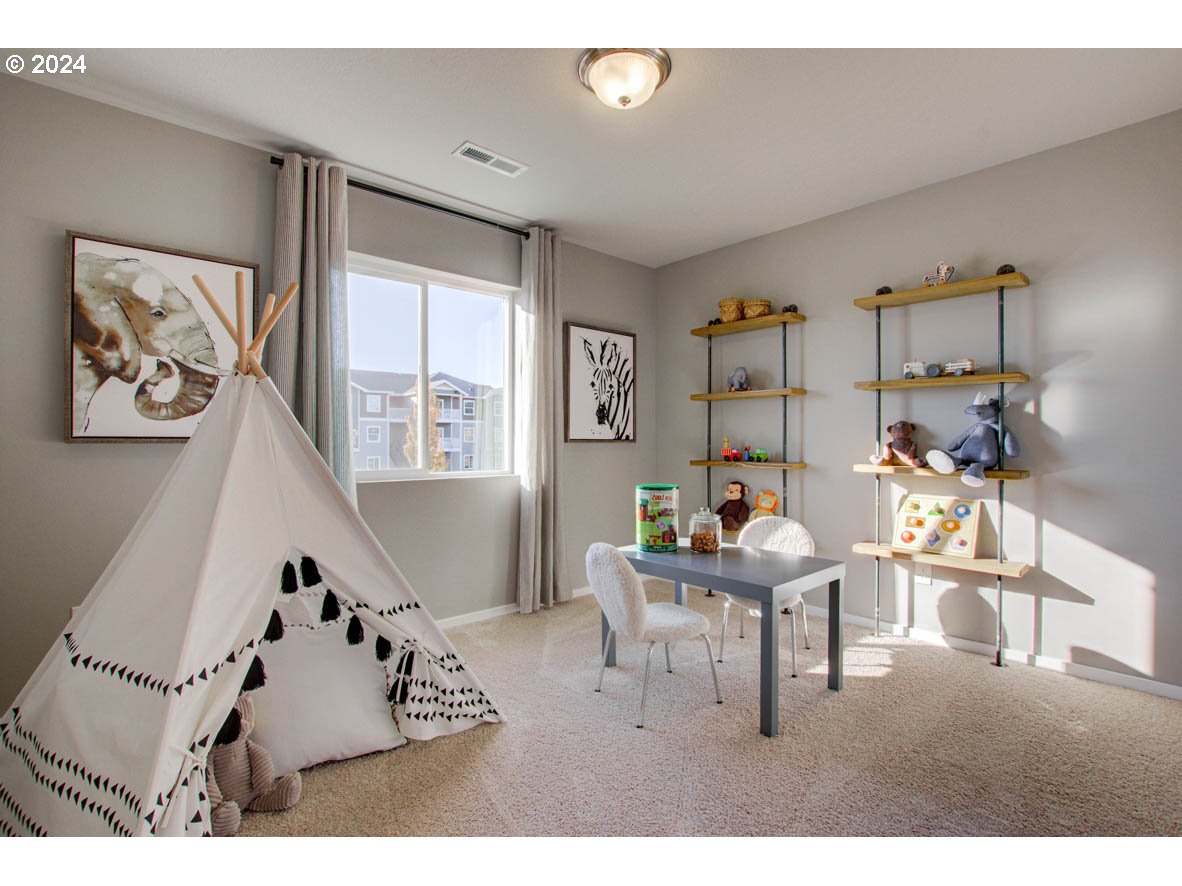 2990 U Street Springfield, OR 97477 - Photo 12 of 36 a living room with furniture and a flat screen tv
