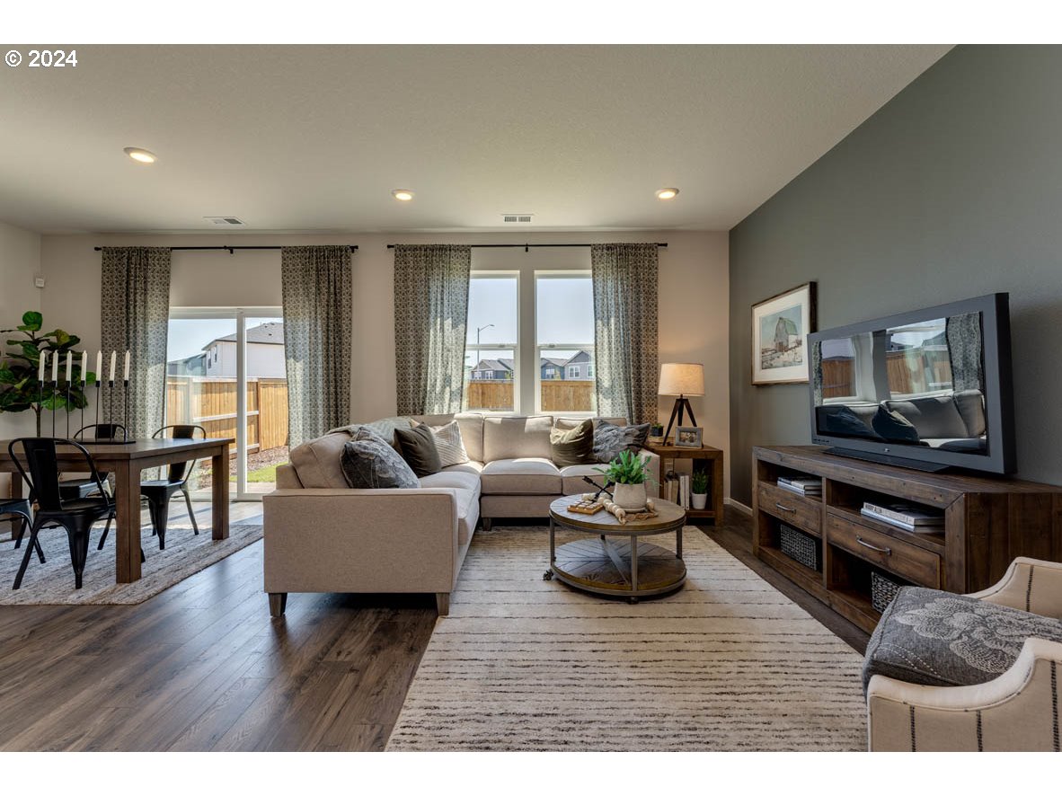 2990 U Street Springfield, OR 97477 - Photo 24 of 36 a living room with furniture and a flat screen tv