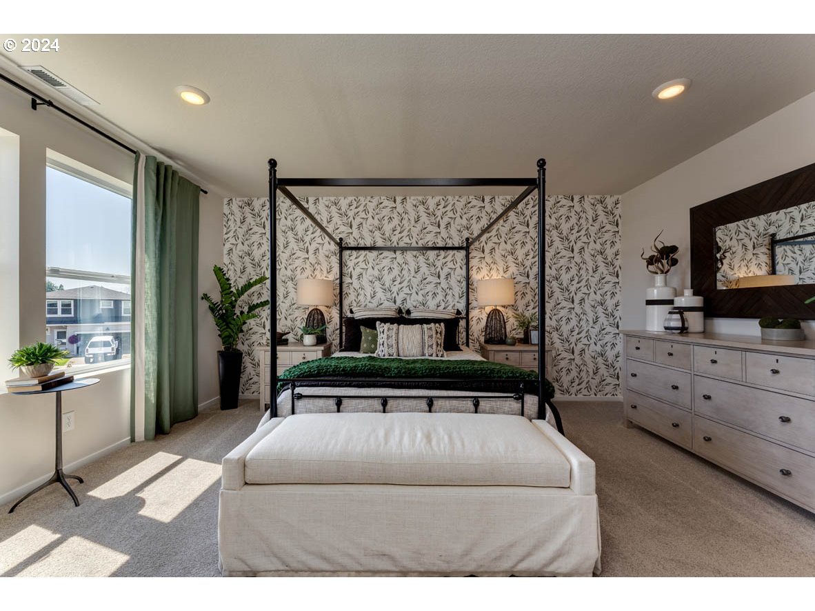 2990 U Street Springfield, OR 97477 - Photo 33 of 36 a bedroom with a bed and a flat screen tv