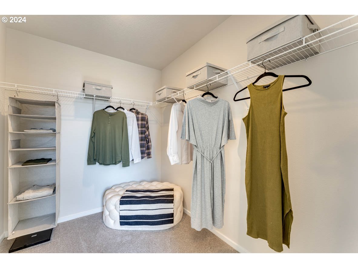 2990 U Street Springfield, OR 97477 - Photo 34 of 36 a view of walk in closet with clothes and shoes