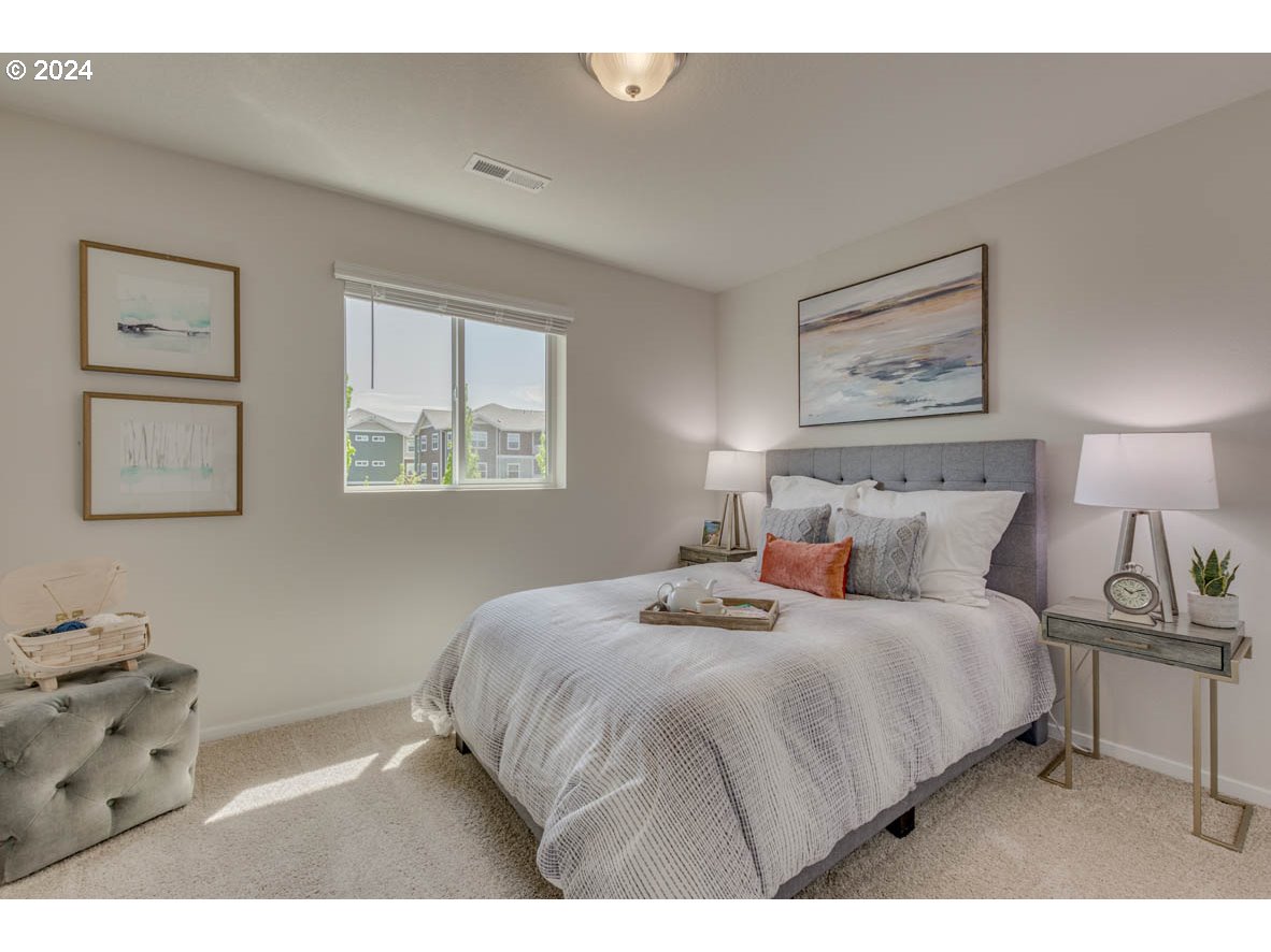 2990 U Street Springfield, OR 97477 - Photo 10 of 36 a bedroom with a bed and a night stand