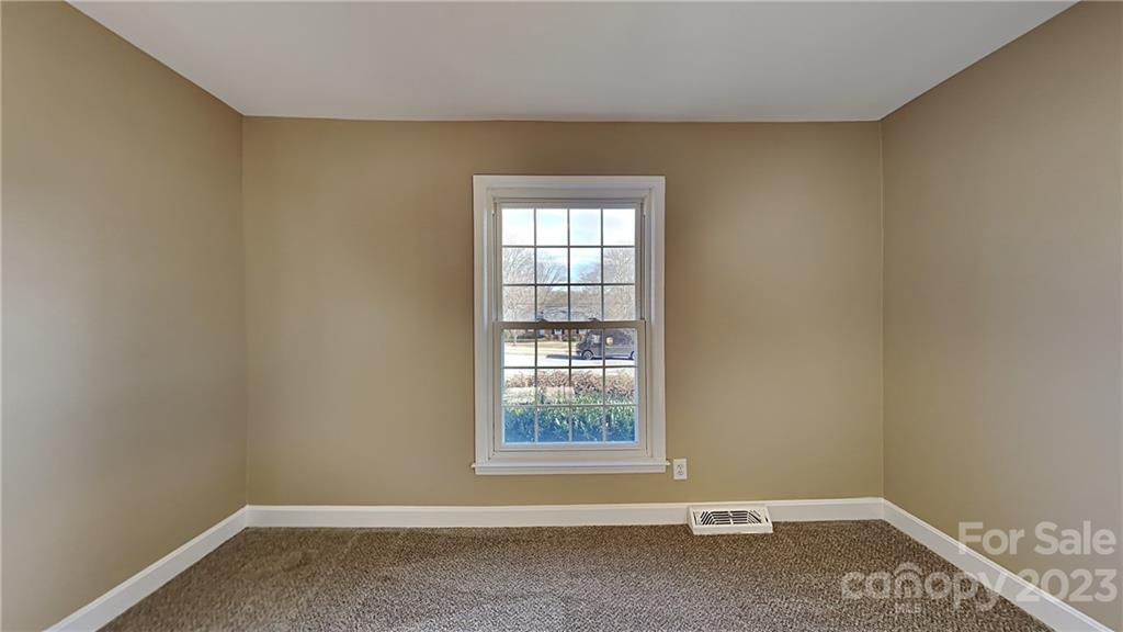 1209 Castlegate Drive Gastonia, NC 28054 - Photo 8 of 13 an empty room with a window