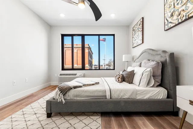 a bedroom with a bed and window