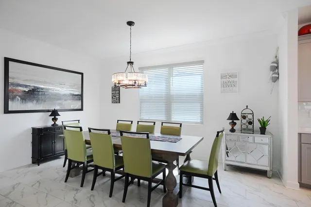 a dining room with furniture and window