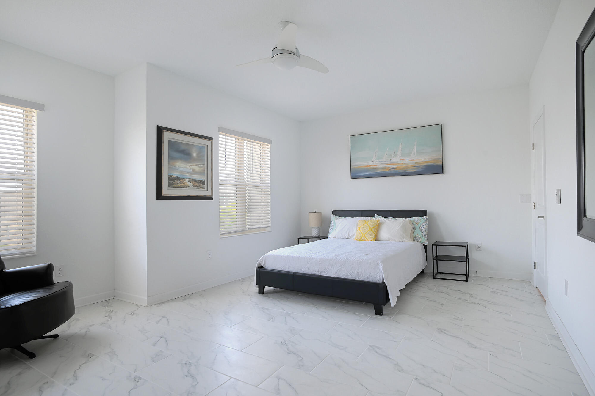 430 Strand Drive Melbourne Beach, FL 32951 - Photo 23 of 36 a spacious bedroom with a bed and a window