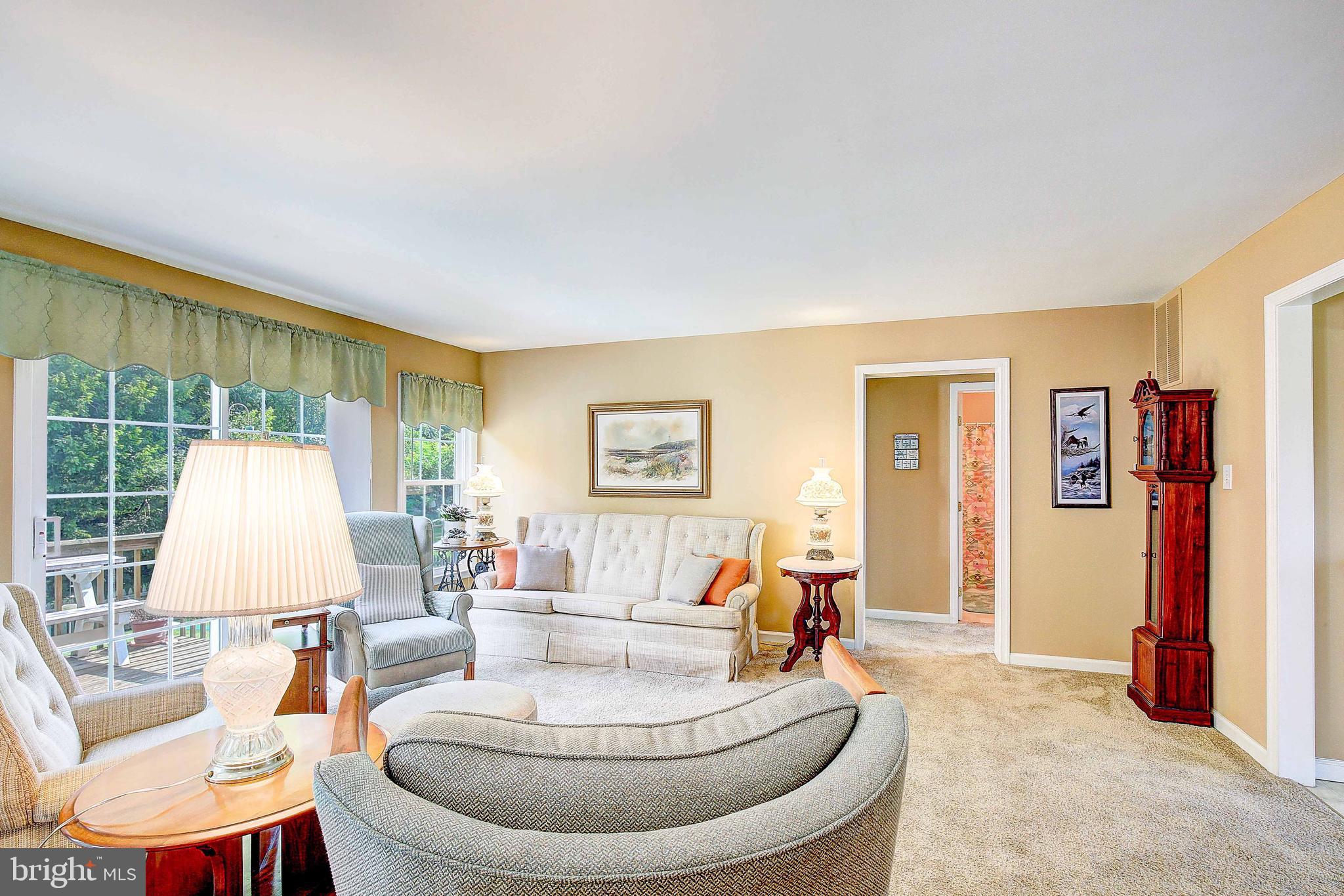 4650 Paul Hance Road Huntingtown, MD 20639 - Photo 24 of 57 a living room with furniture and a large window