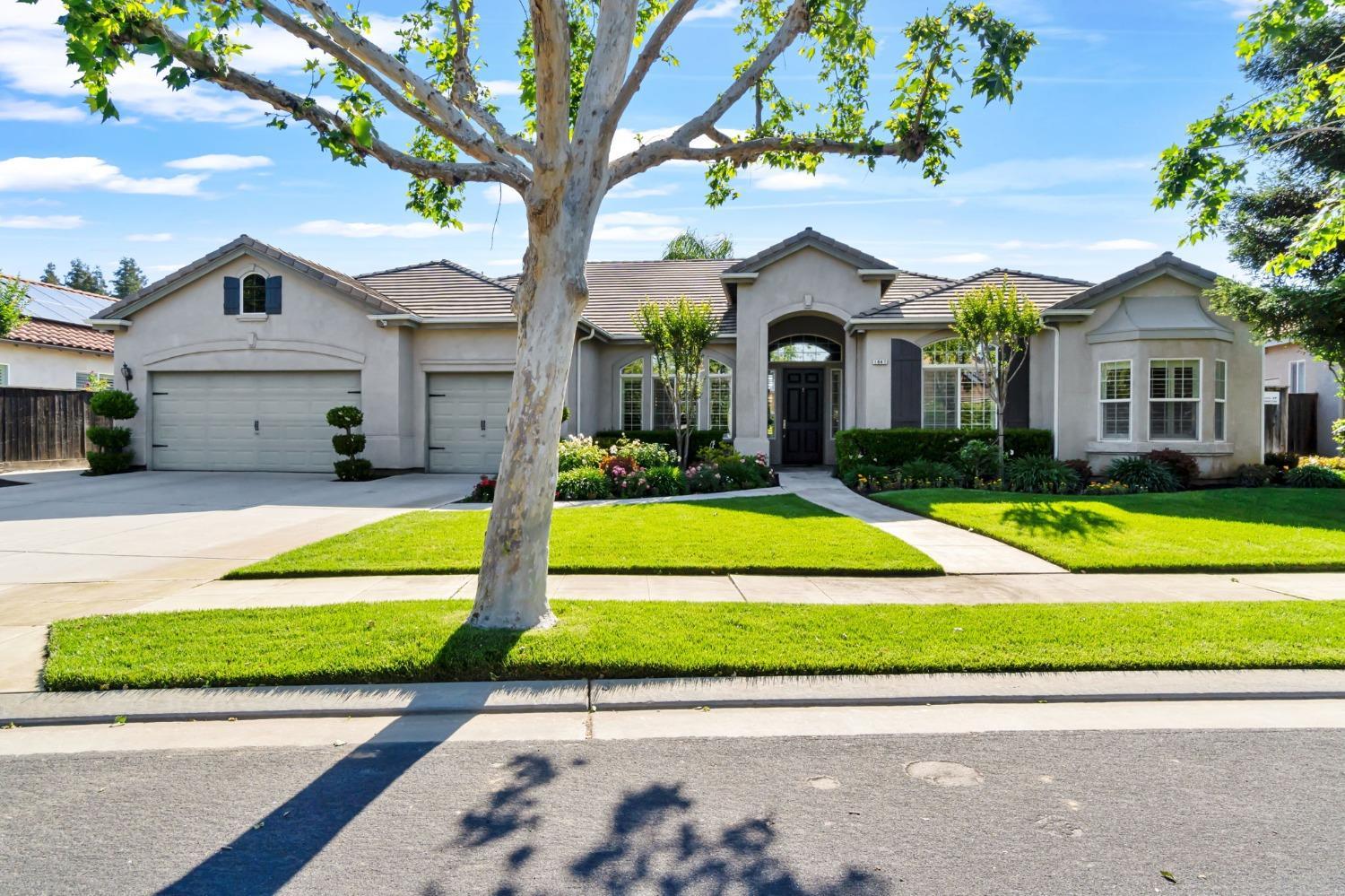 a view of house with yard and green space
