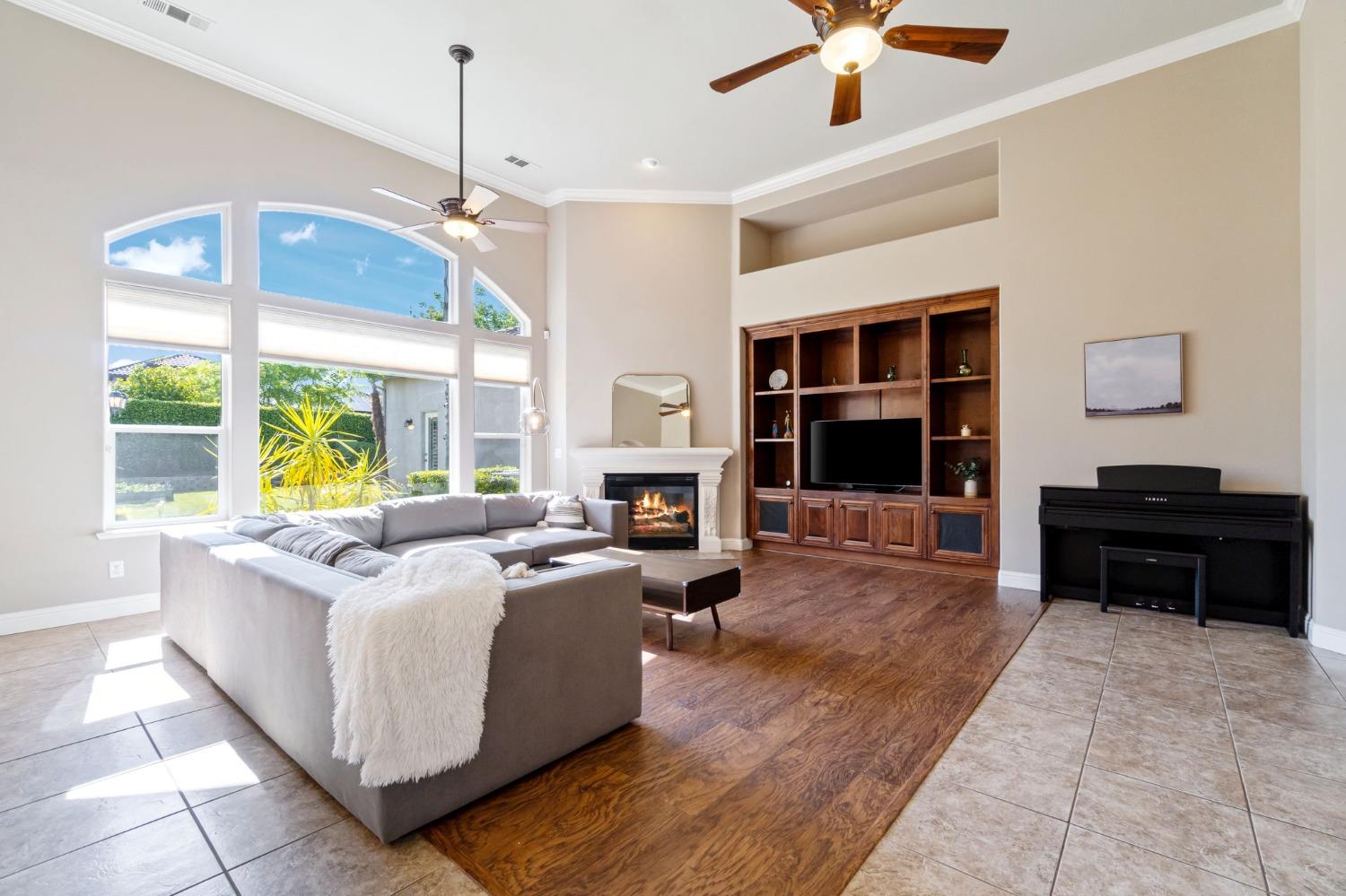 1847 Megan Avenue Clovis, CA 93619 - Photo 18 of 40 a living room with furniture large window and flat screen tv