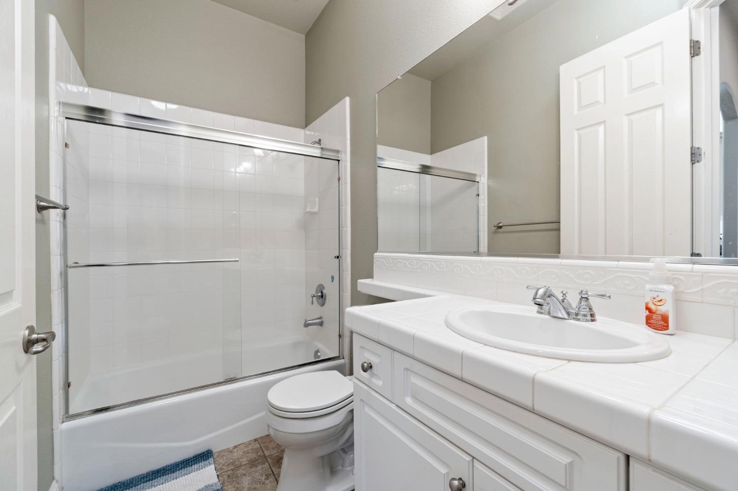 1847 Megan Avenue Clovis, CA 93619 - Photo 22 of 40 a bathroom with a sink toilet and shower