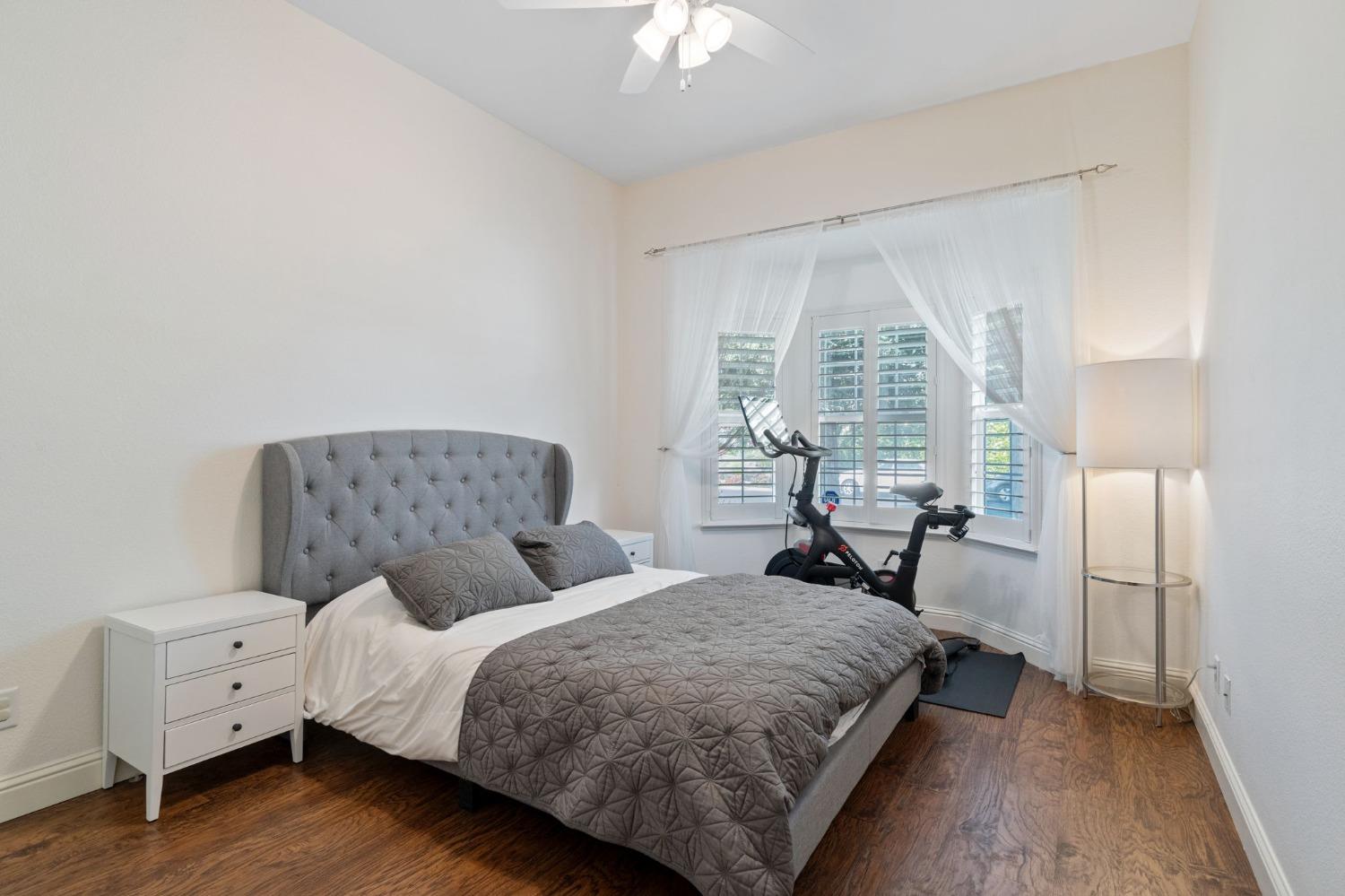 1847 Megan Avenue Clovis, CA 93619 - Photo 24 of 40 a bedroom with a bed and a chandelier