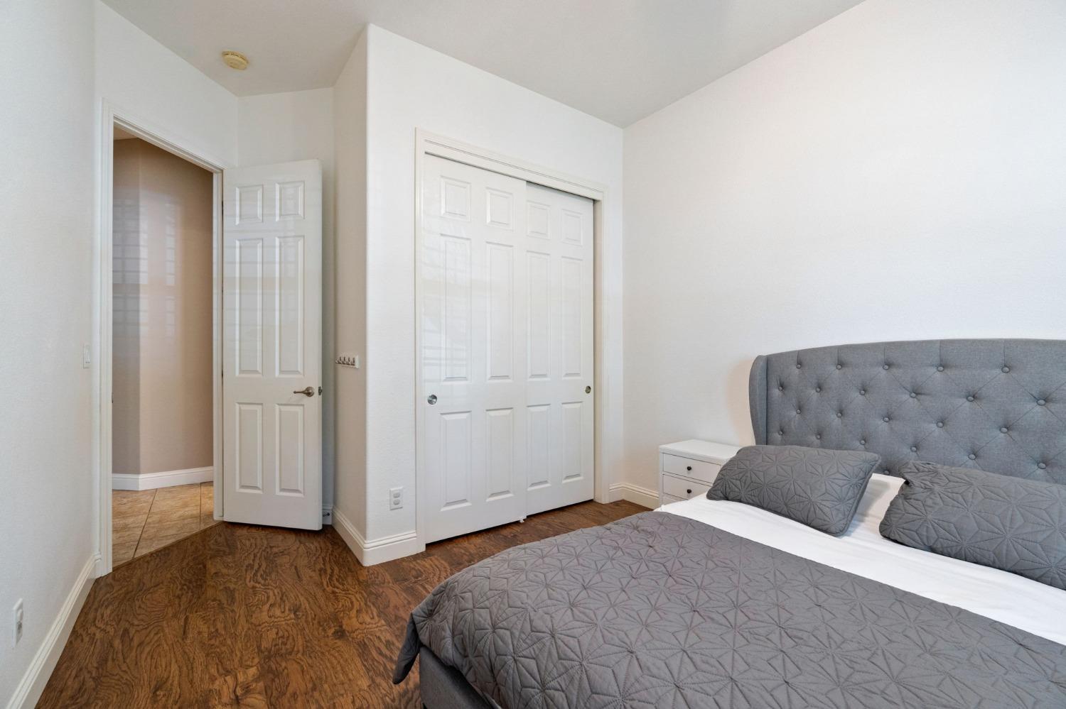 1847 Megan Avenue Clovis, CA 93619 - Photo 25 of 40 a bedroom with a bed and a painting on the wall