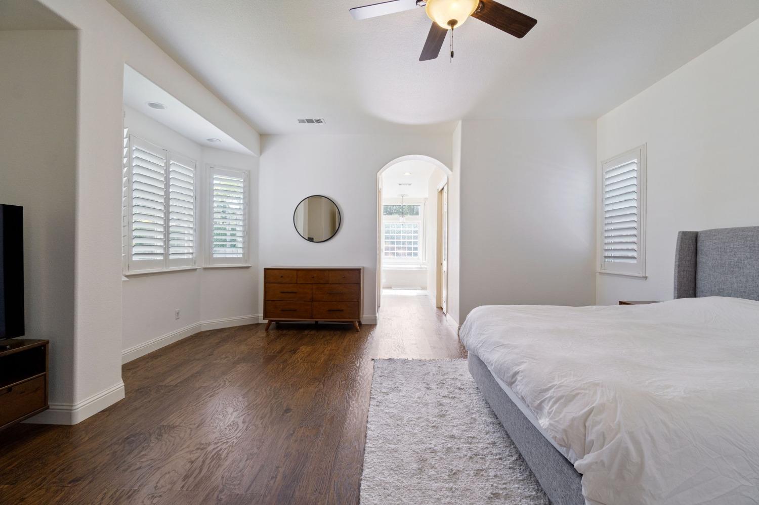 1847 Megan Avenue Clovis, CA 93619 - Photo 30 of 40 a bedroom with a bed and a chandelier