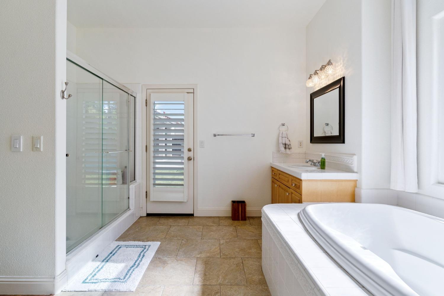 1847 Megan Avenue Clovis, CA 93619 - Photo 33 of 40 a bathroom with a sink a toilet and shower