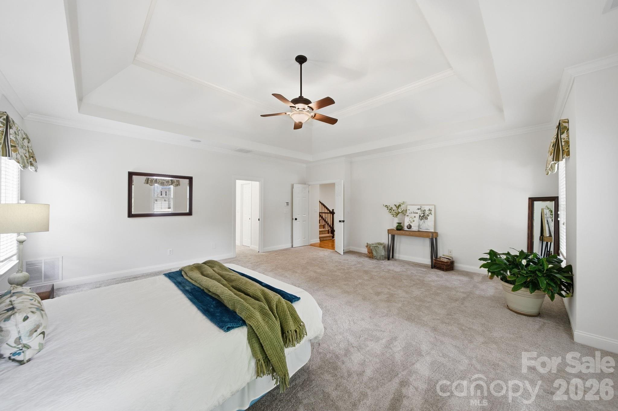 1802 Summit View Place Waxhaw, NC 28173 - Photo 20 of 47 a bedroom with a bed and a chandelier
