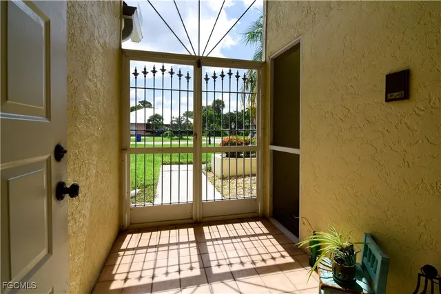 a view of a door and wooden floor