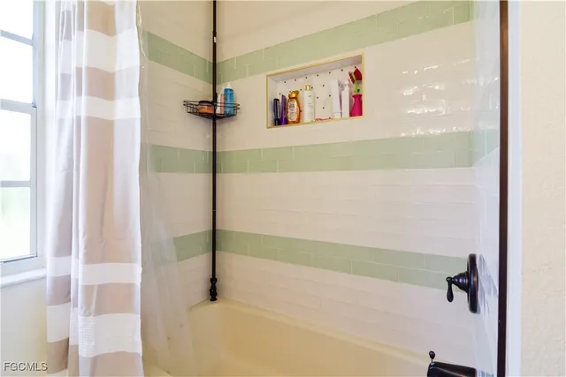 a view of a bedroom with utility room and wooden floor