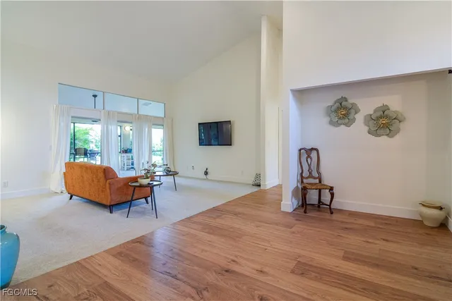 a view of a hardwood floor and a sink in a room
