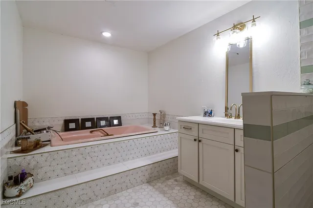 a white toilet sitting next to a white sink