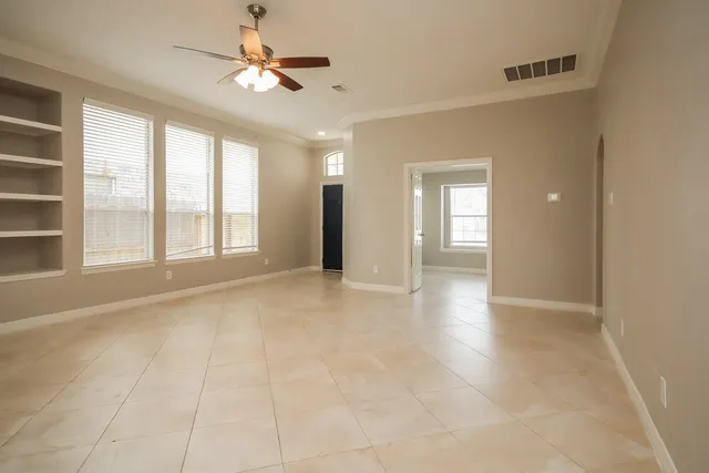 a view of an empty room with a window