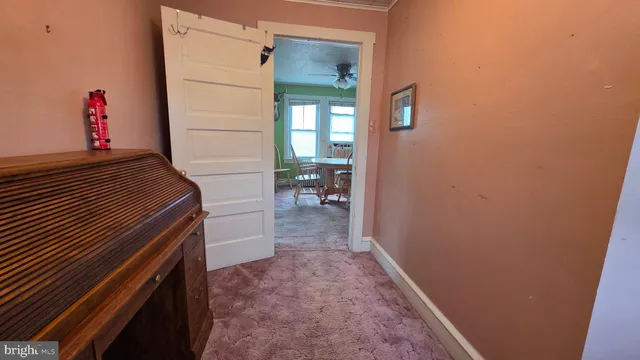 a view of hallway with wooden floor