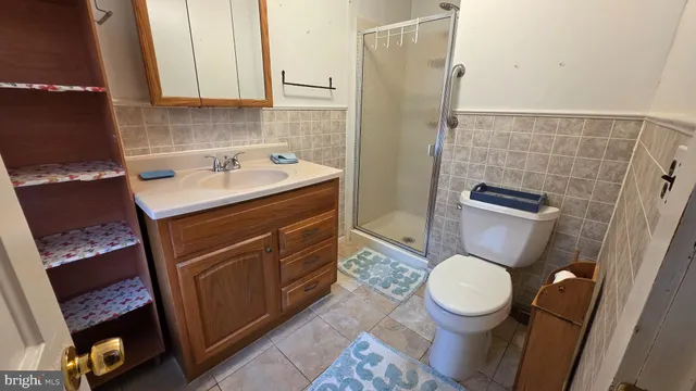 a bathroom with a toilet a sink and a shower