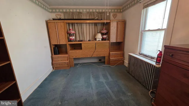 a view of room with furniture and a window