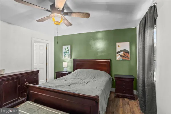 a bedroom with a bed and a dresser