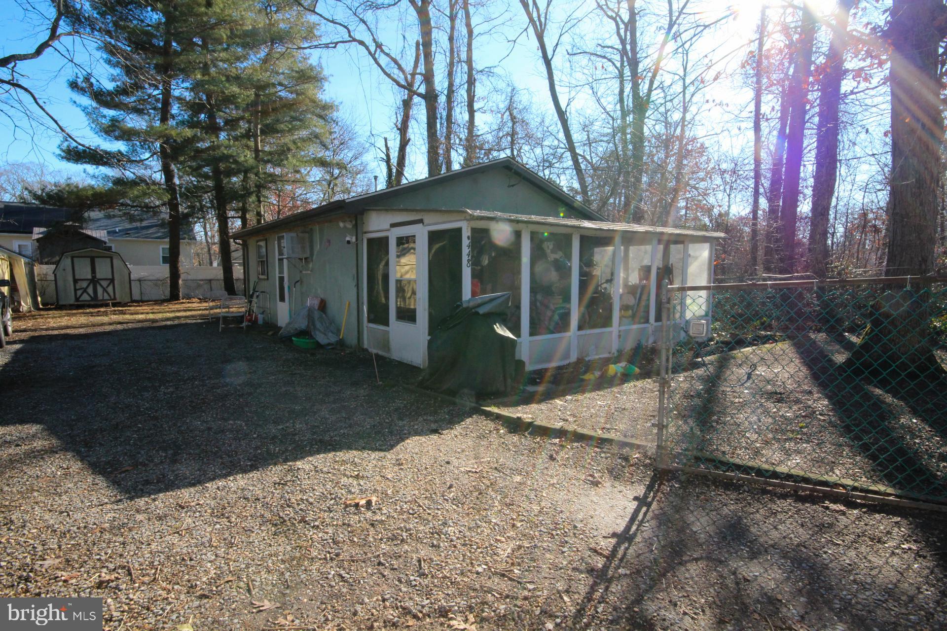 448 Mistle Road Millville, NJ 08332 - Photo 14 of 15 a front view of a house with a yard and garage