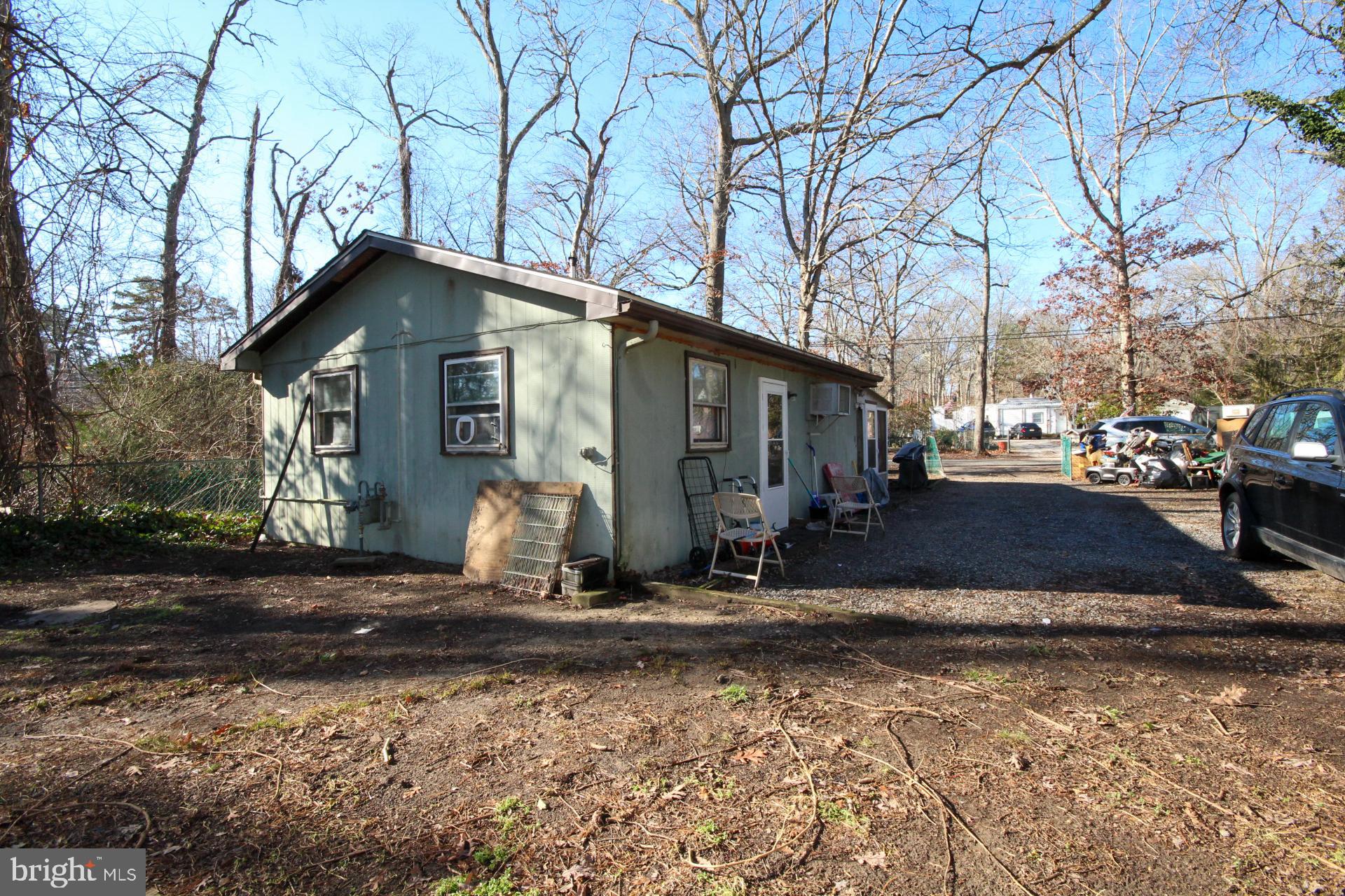 448 Mistle Road Millville, NJ 08332 - Photo 3 of 15 a front view of a house with garden