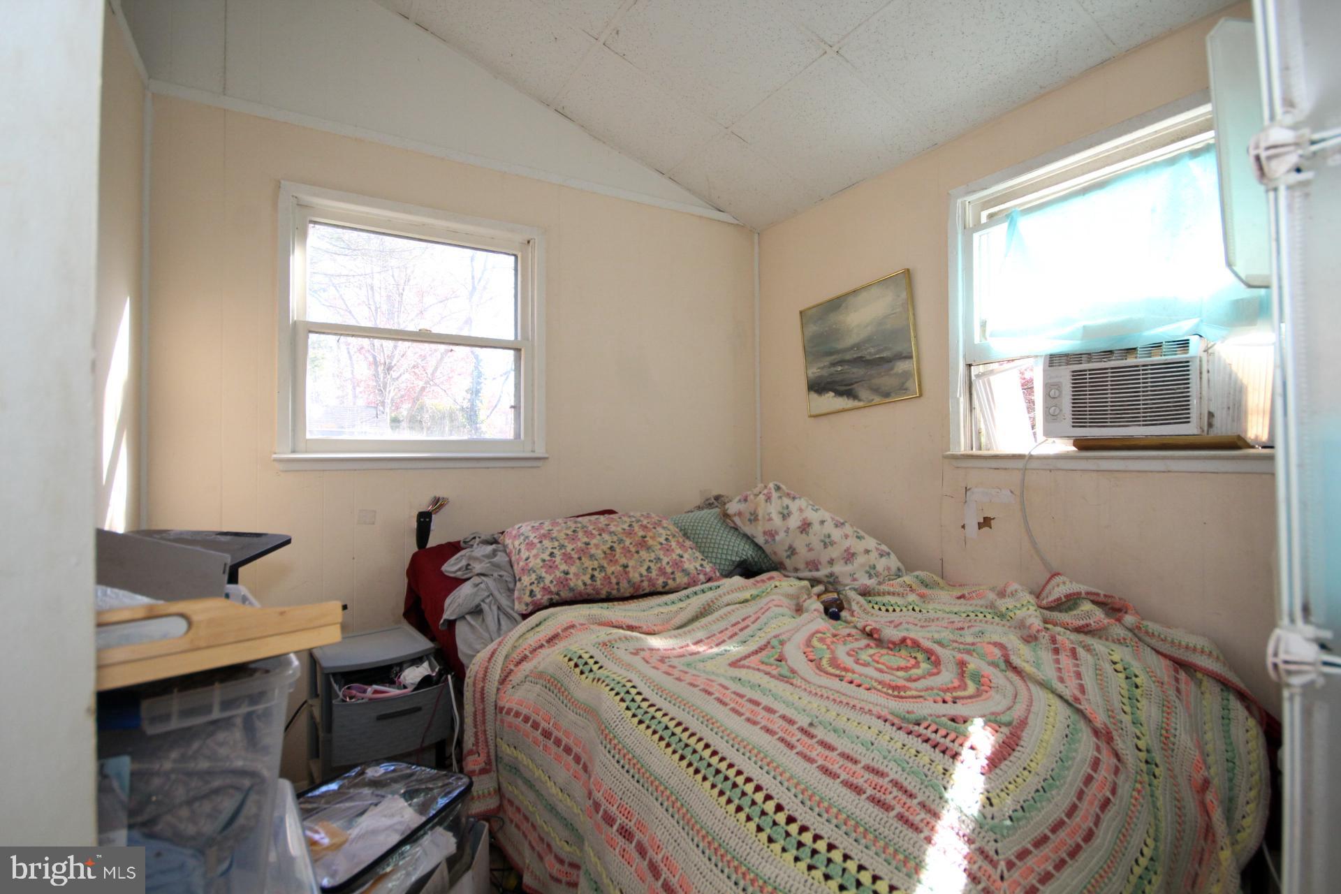 448 Mistle Road Millville, NJ 08332 - Photo 10 of 15 a bedroom with a bed and wooden floor