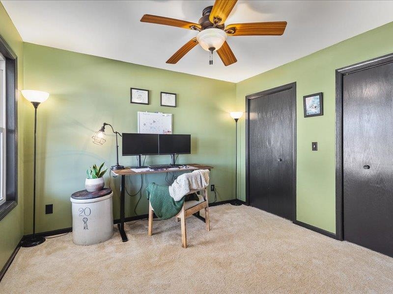911.41 Melugins Grove Compton, IL 61318 - Photo 26 of 68 a bedroom with a bed and a chandelier fan