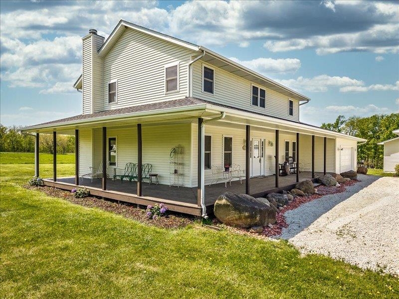 911.41 Melugins Grove Compton, IL 61318 - Photo 9 of 68 front view of a house with a big yard