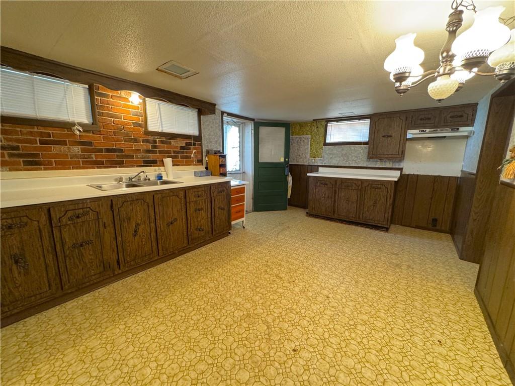 1076-1078 Addison Street Washington, PA 15301 - Photo 11 of 50 a view of a kitchen with a sink and cabinets