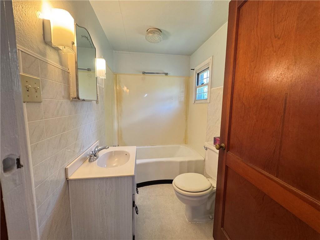 1076-1078 Addison Street Washington, PA 15301 - Photo 19 of 50 a bathroom with a sink a toilet and shower