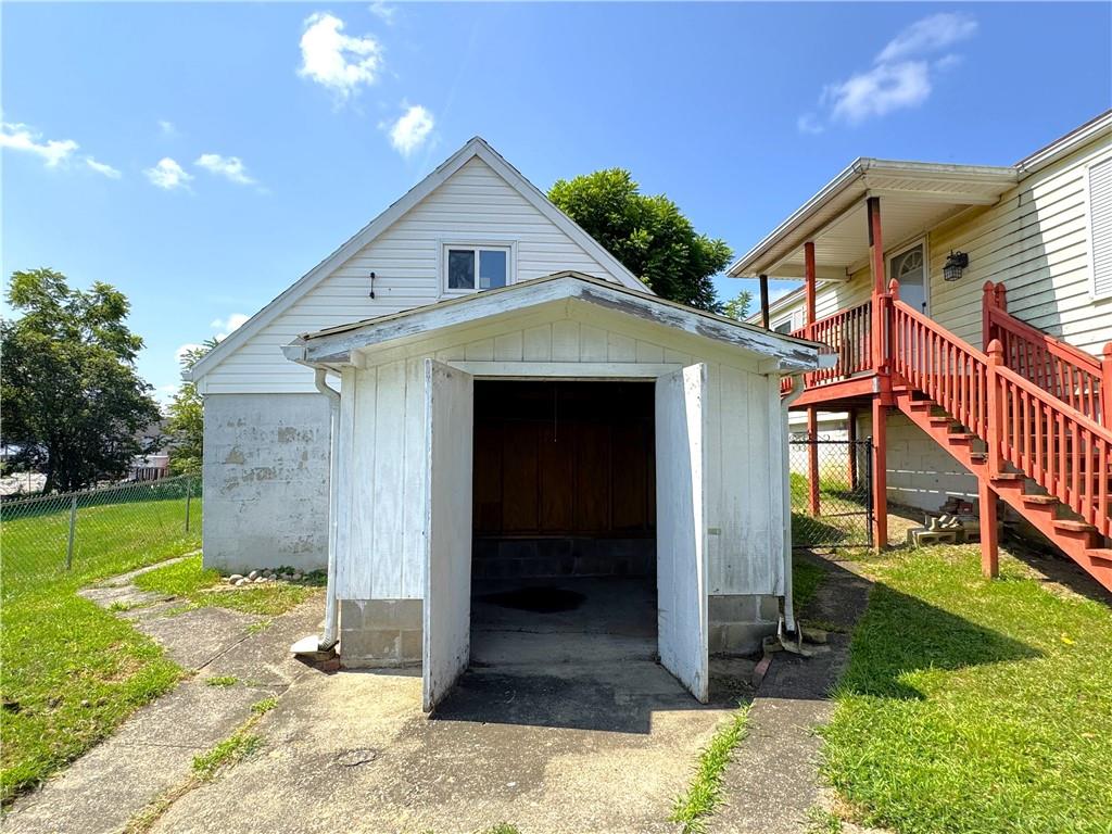 1076-1078 Addison Street Washington, PA 15301 - Photo 31 of 50 a view of a house with a yard and garage