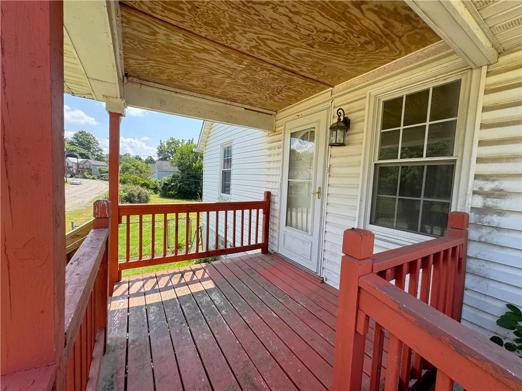 1076-1078 Addison Street Washington, PA 15301 - Photo 35 of 50 a balcony with wooden floor and outdoor seating