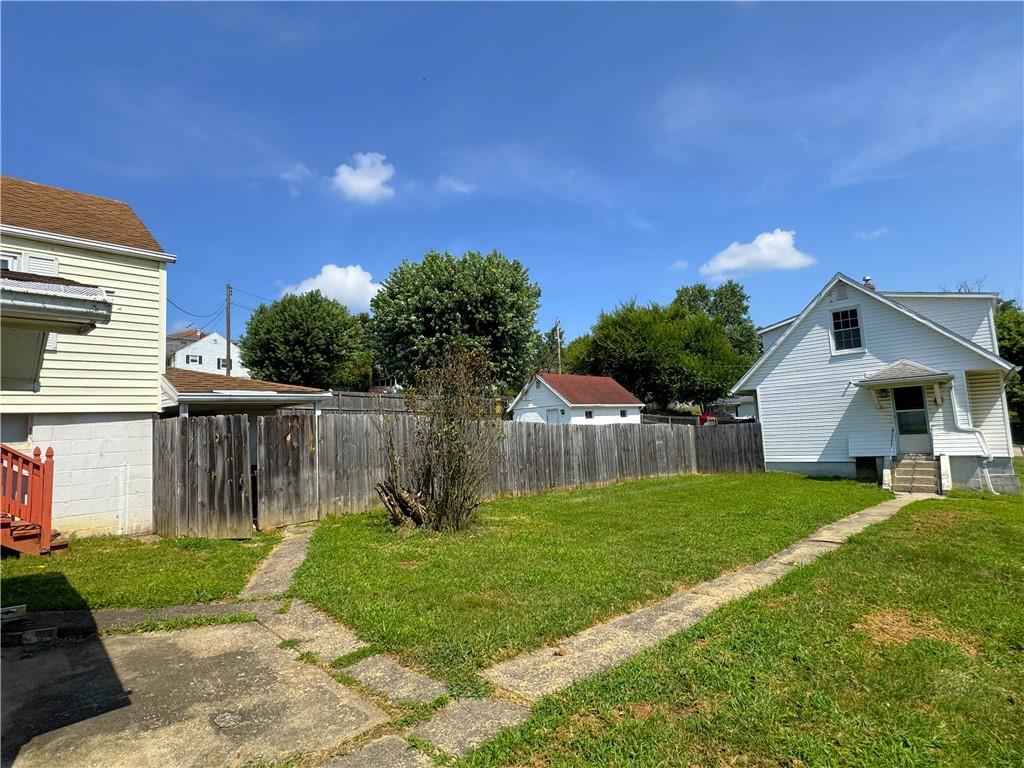 1076-1078 Addison Street Washington, PA 15301 - Photo 37 of 50 a view of a house with a yard and a garden