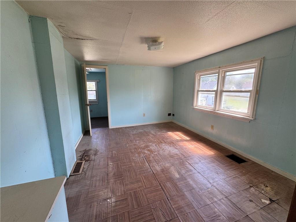 1076-1078 Addison Street Washington, PA 15301 - Photo 45 of 50 a view of empty room with wooden floor and fan