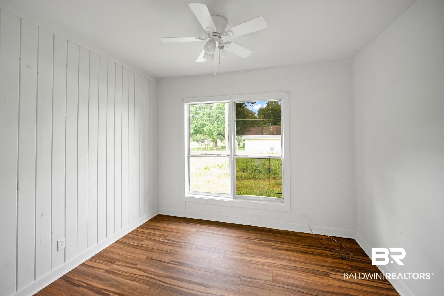 19575 Keller Road Foley, AL 36535 - Photo 6 of 17 Unfurnished room featuring wood finished floors and a ceiling fan