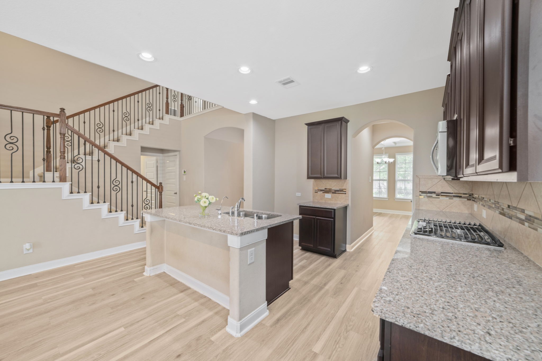 22523 Birch Ridge Meadow Drive Spring, TX 77389 - Photo 9 of 39 a kitchen with stainless steel appliances granite countertop a stove and a sink